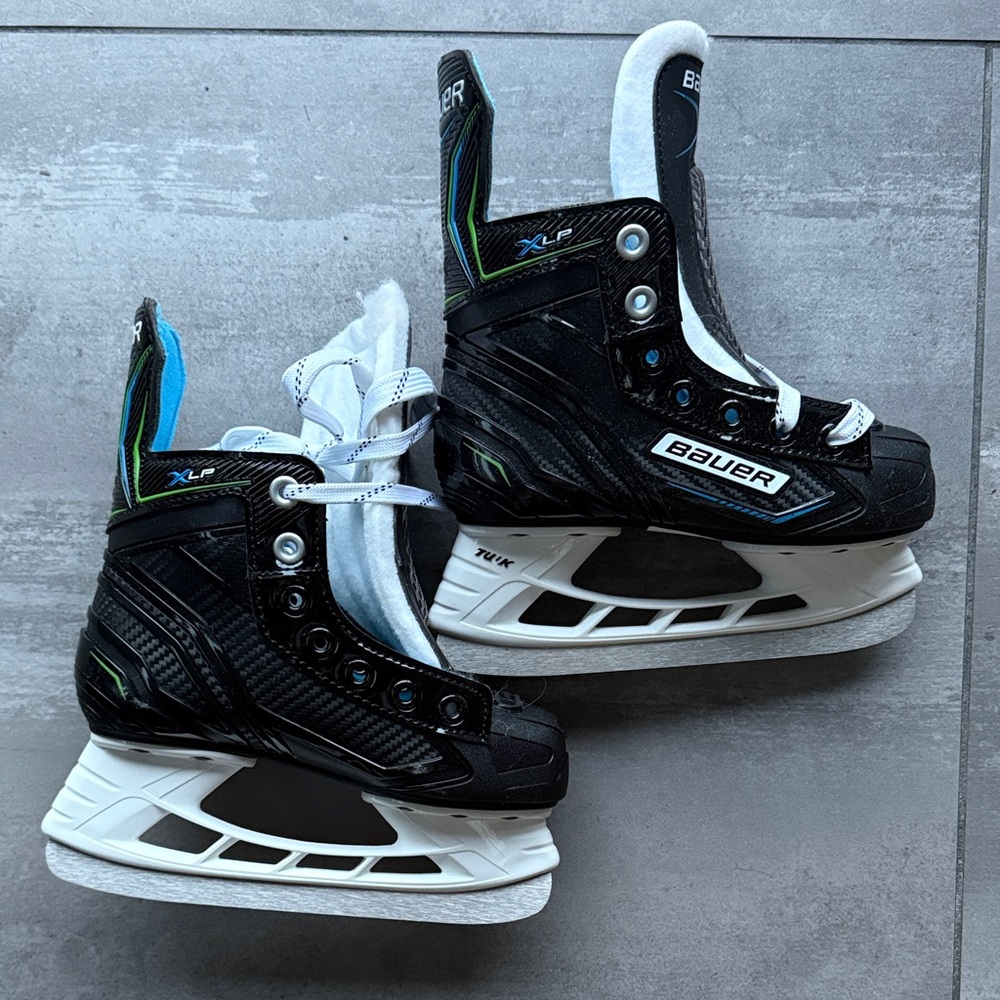 Bauer Black and White Ice Hockey Skates with Blue Accents